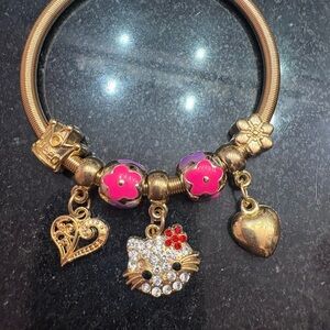 Gold Bracelet with Pink and Purple Charms